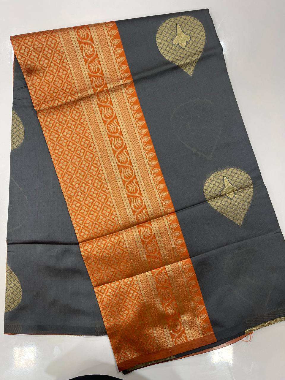 Gray semi silk saree with with orange border