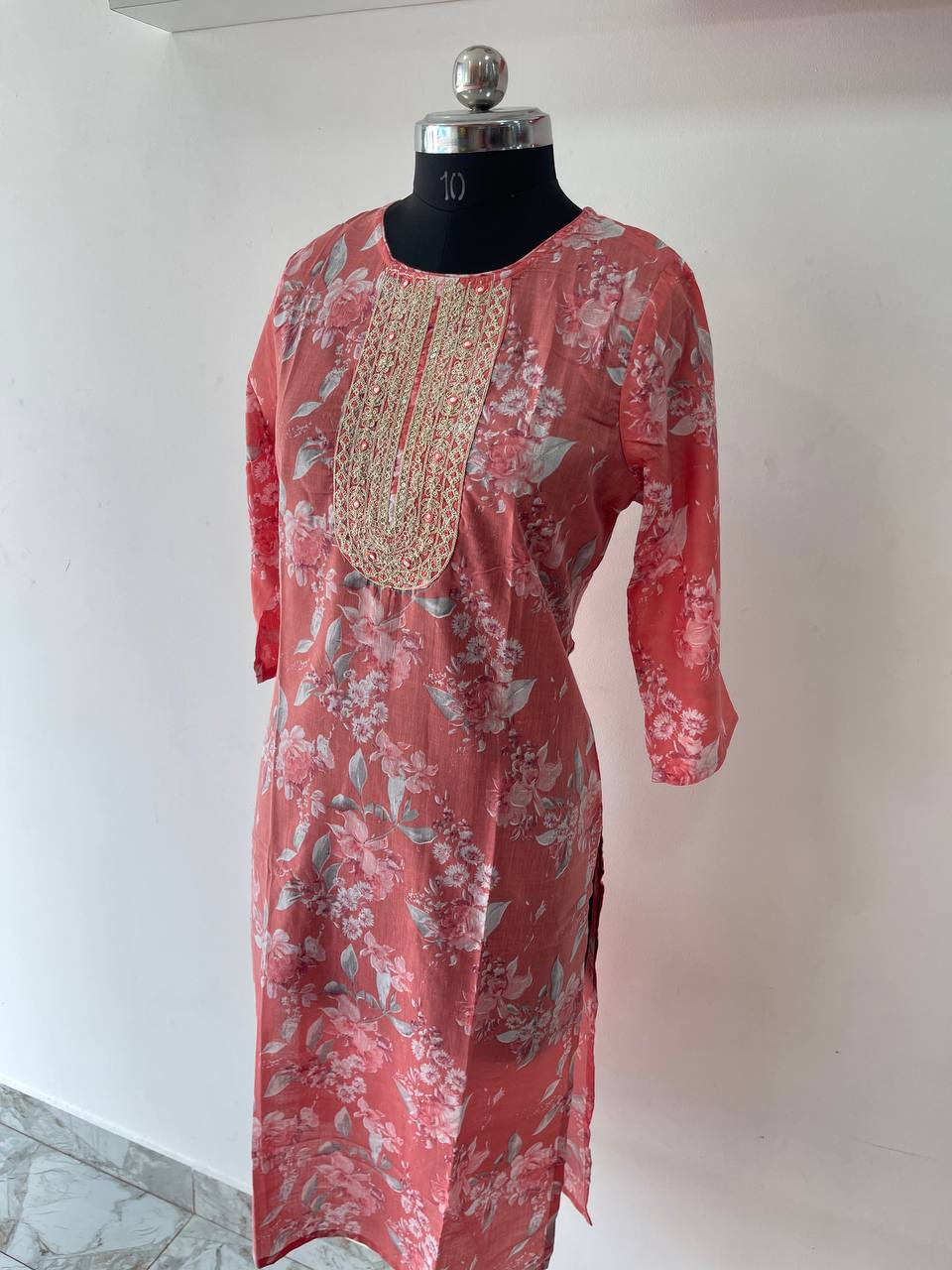 Peach floral cotton churidar with gold embroidery works