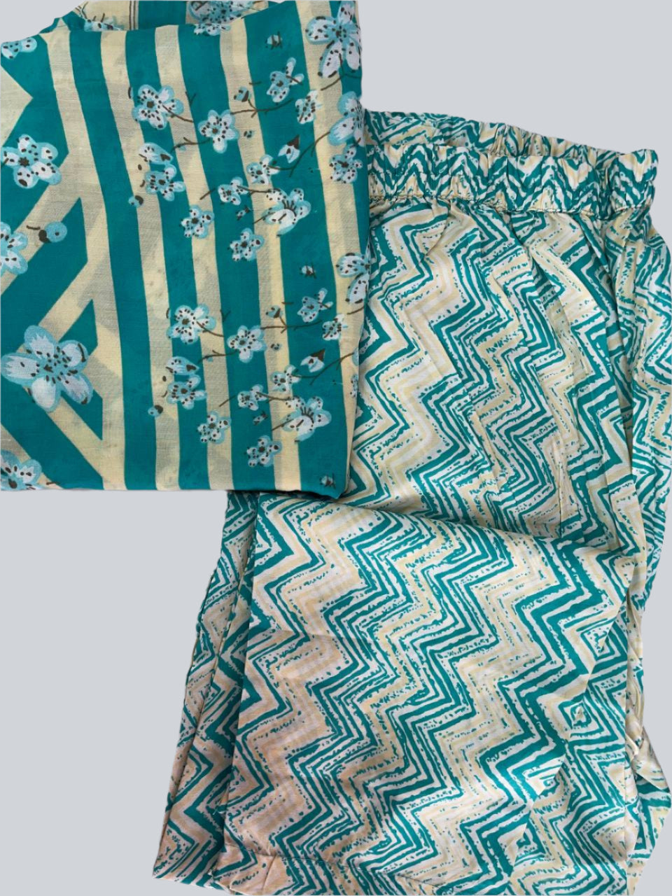 Three pieces of fabric with teal and beige patterns on a white background
