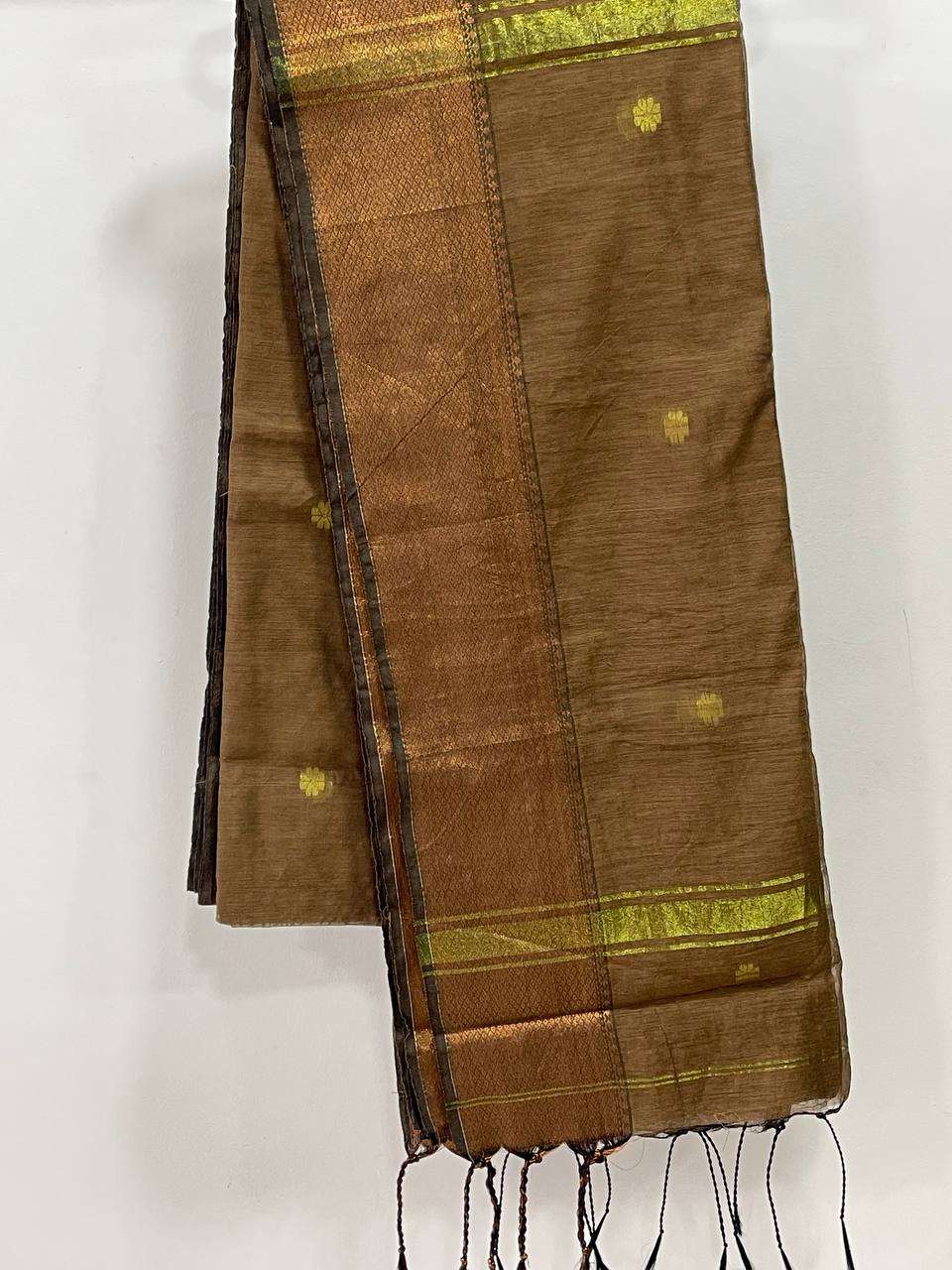 Brown saree with gold border and patterns on a white background