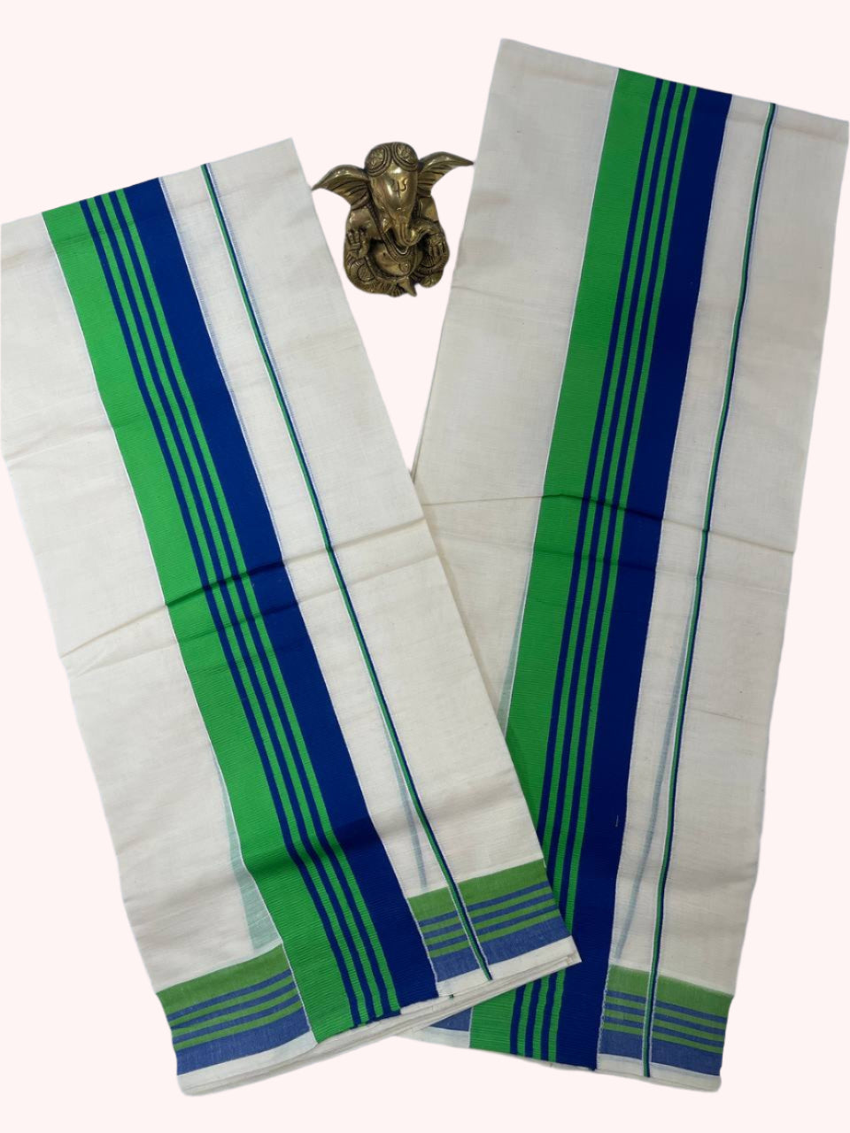 Two white sarees with green and blue stripes on a white background
