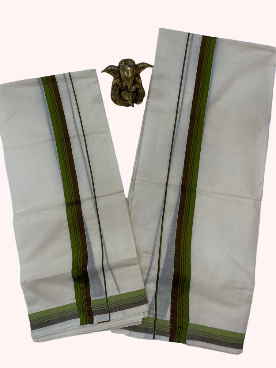 White saree with green and brown stripes on a white background