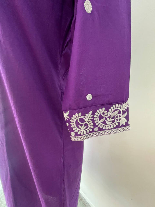 Purple garment with white embroidery on a white background