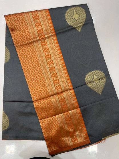 Gray semi silk saree with with orange border 