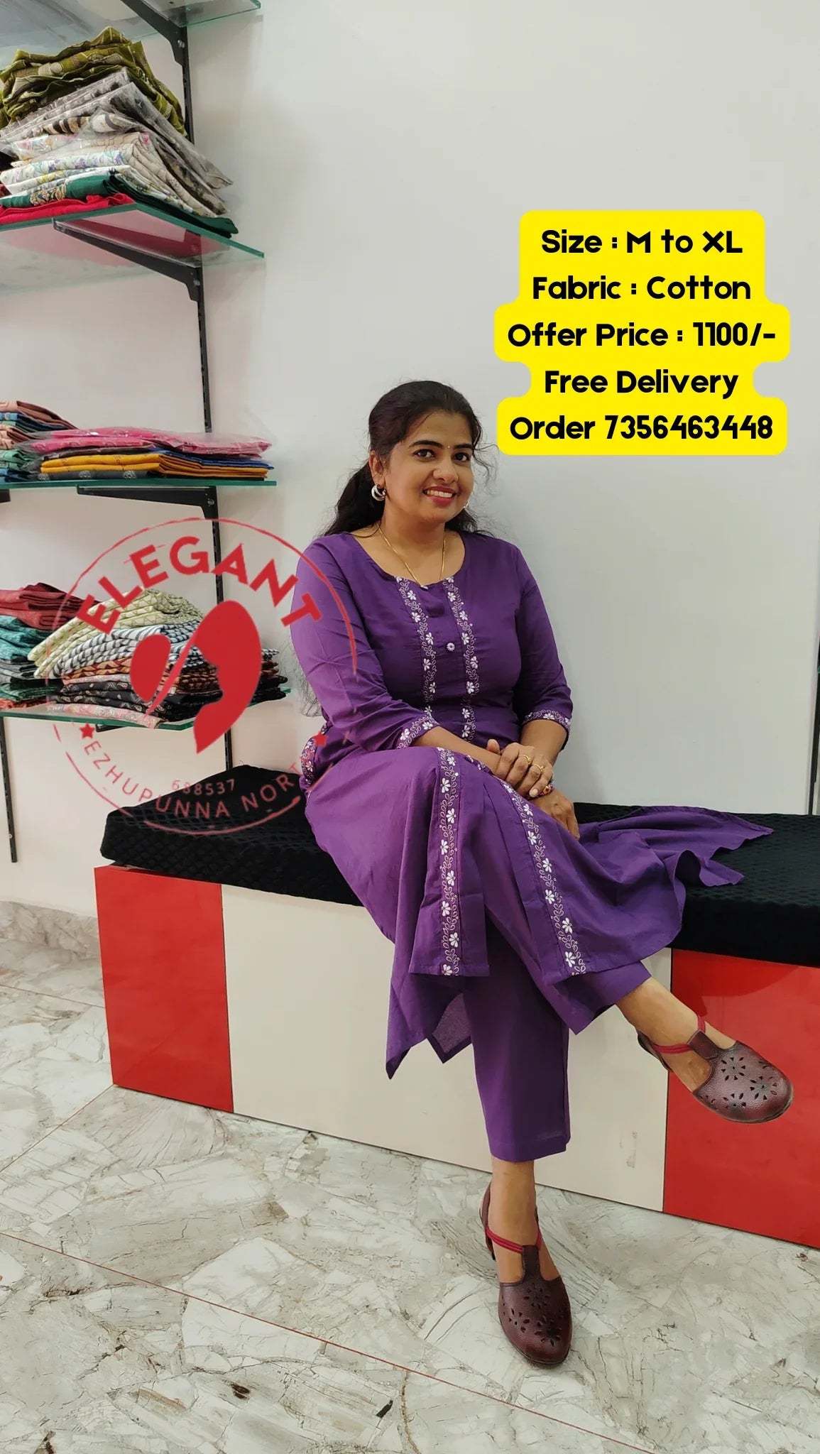 Woman wearing purple cotton Kurthi Set sitting on a bench in a store with fabric shelves in the background
