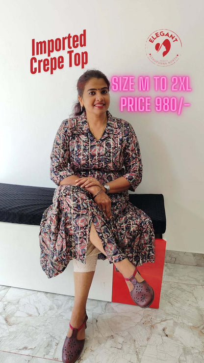 Woman wearing a stylish imported crepe top sitting on a bench, showcasing the versatile and elegant crepe fabric top available in sizes M to 2XL.