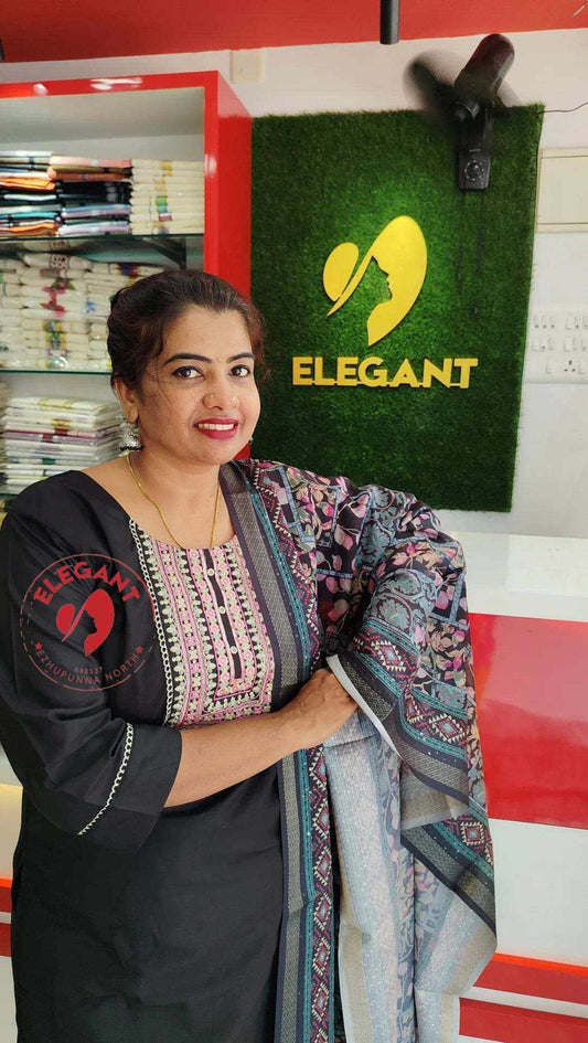 Woman displaying Roman Silk Churidar pants in an Elegant store setting