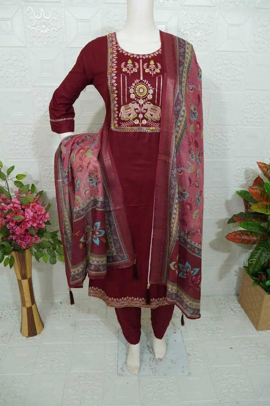 Maroon Roman Silk churidar with intricate embroidery and matching floral patterned dupatta displayed on mannequin