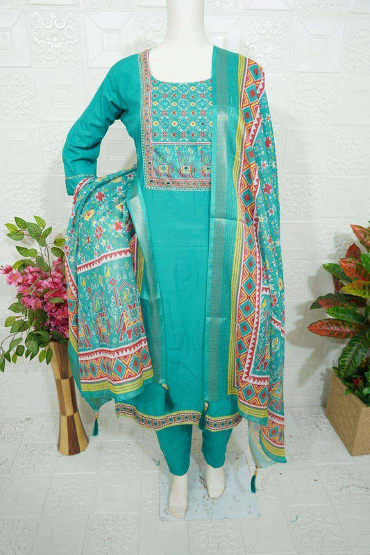 Teal Roman Silk churidar with intricate embroidery and patterned dupatta on mannequin