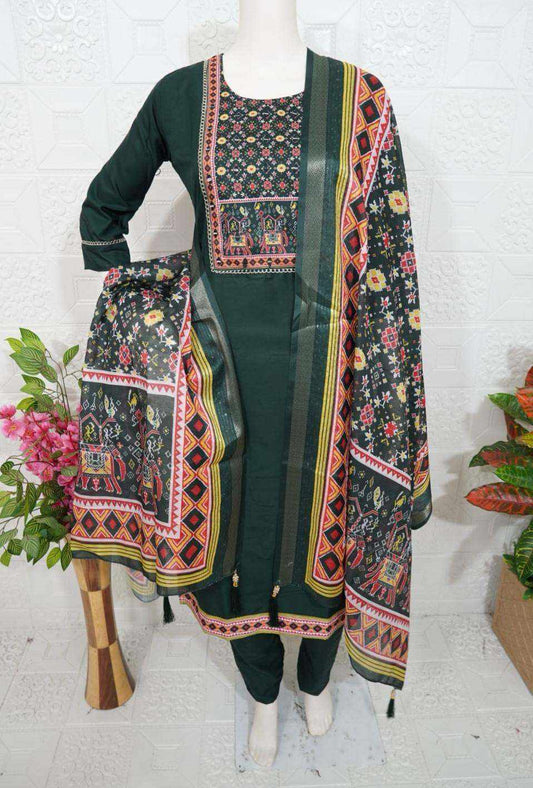 Elegant Roman Silk churidar set with intricate floral and geometric patterns in dark green and multicolor design