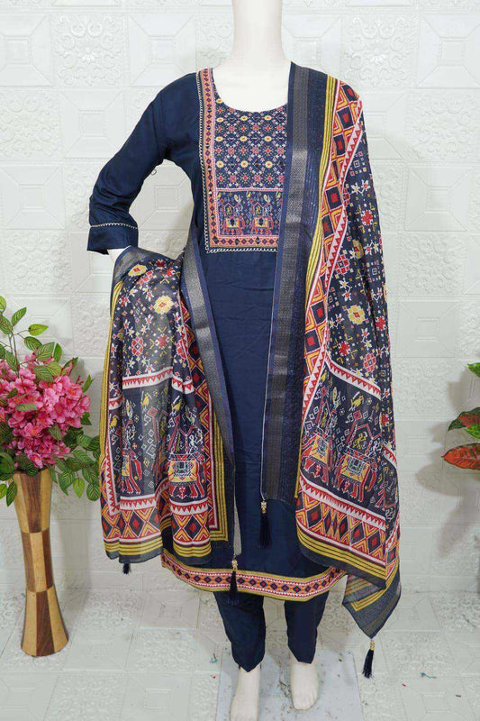 Elegant navy blue Roman Silk Churidar with intricate multicolor embroidery and matching printed dupatta displayed on mannequin
