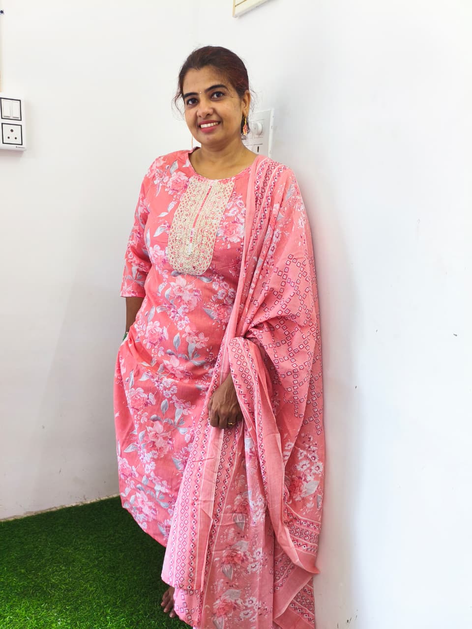 Peach floral cotton churidar set with gold embroidery works