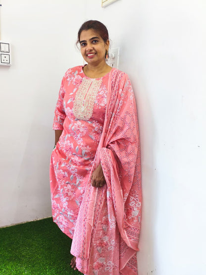 Peach floral cotton churidar set with gold embroidery works