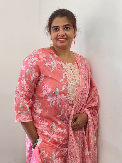 Peach floral cotton churidar set with gold embroidery works
