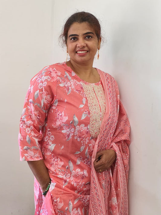 Peach floral cotton churidar set with gold embroidery works