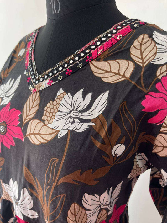 Floral patterned garment on a mannequin with a white background