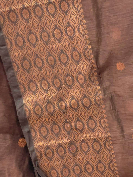 Brown fabric with intricate pattern and texture