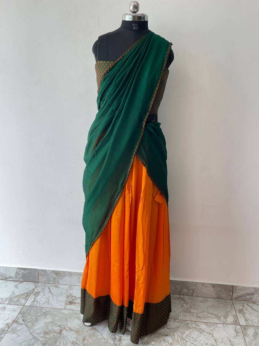 green dupatta and orange skirt dhavani set