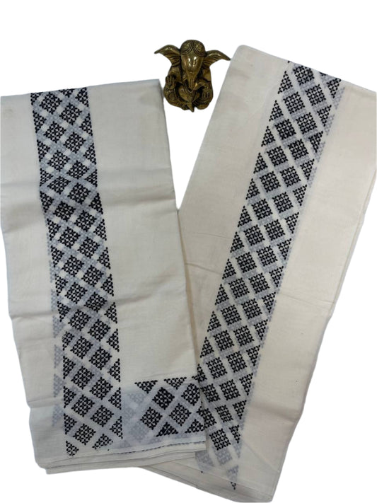 White and black patterned cotton set mund with a decorative gold brooch on a white background